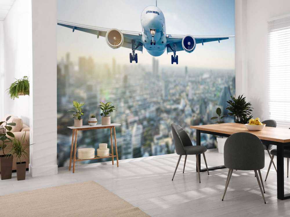 Descending airplane over a city