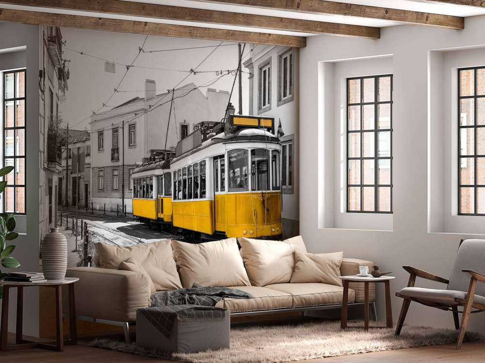 Yellow tram in a black and white street