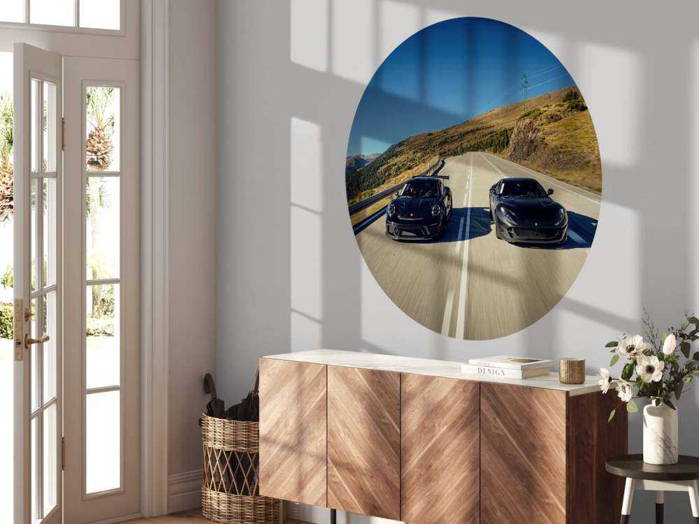 Black supercars in the mountains