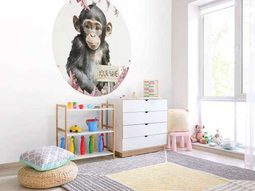 Baby chimpanzee in the jungle pink