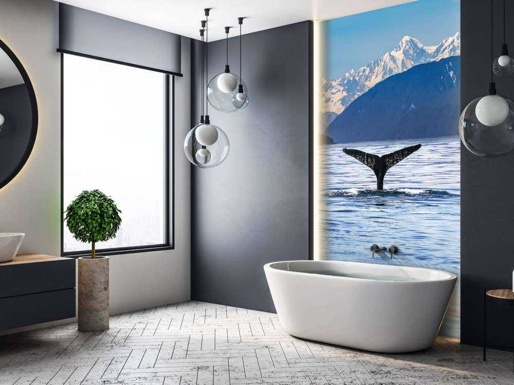 Diving whale with mountains in the background