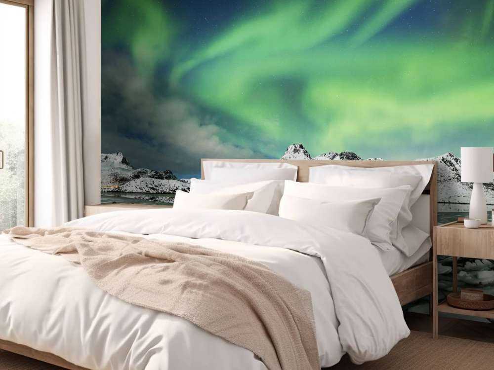 Northern lights above winter landscape