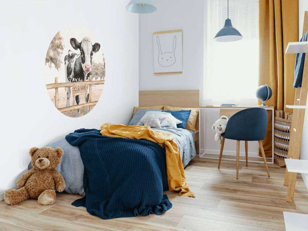 Young cow in a meadow taupe