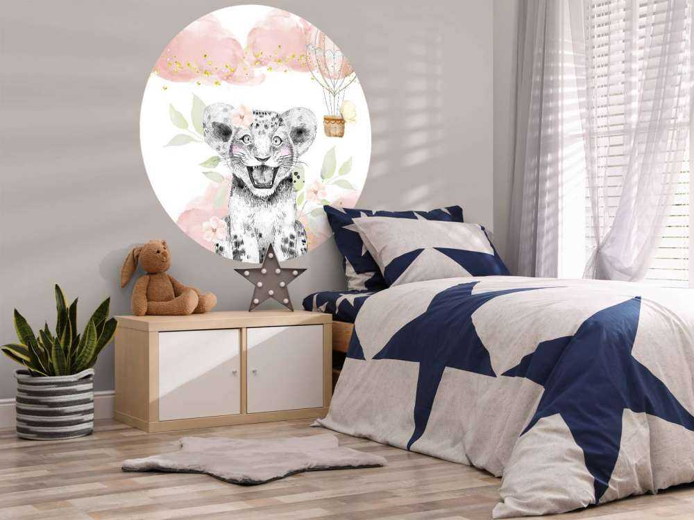 Joyful lion cub and balloon