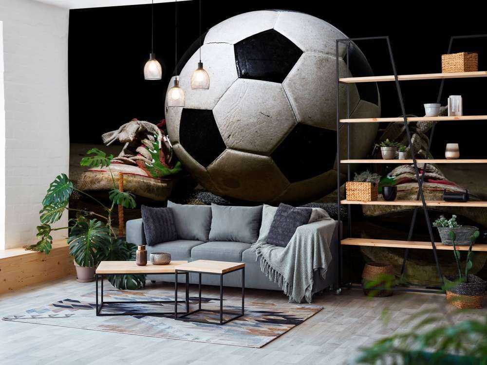 Football between two sneakers