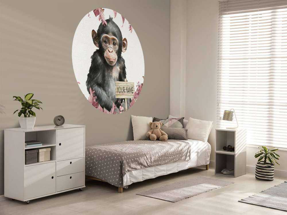 Baby chimpanzee in the jungle pink