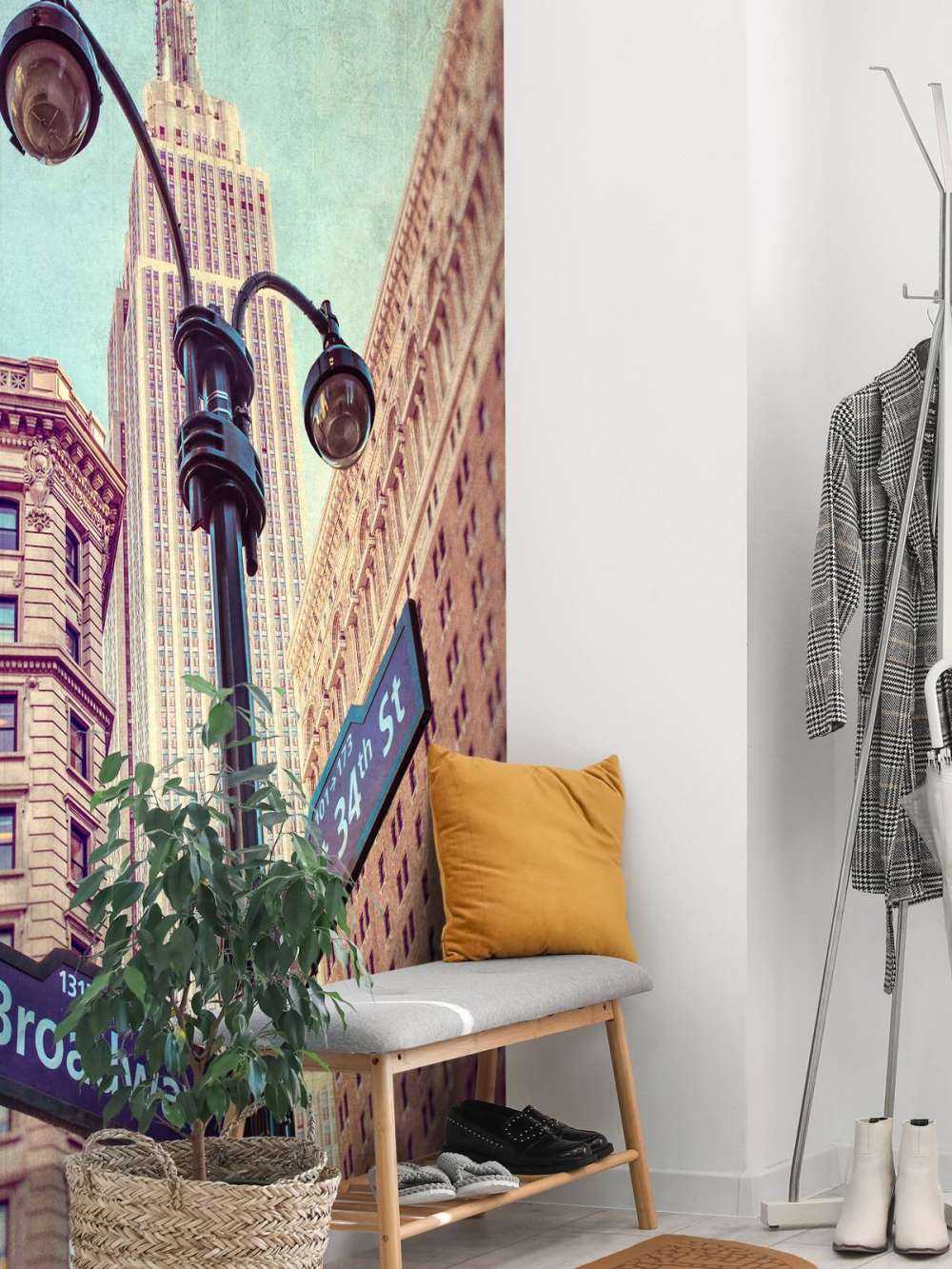 Street lamp and street signs with Empire State building in background - New York