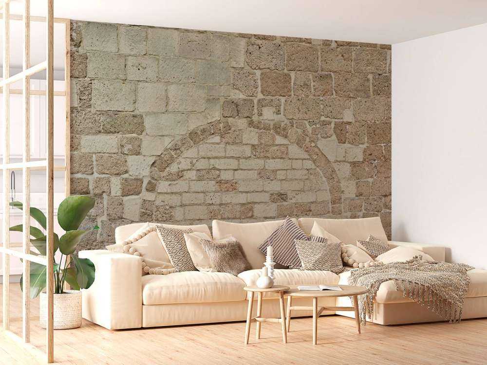 Old stone wall with arch