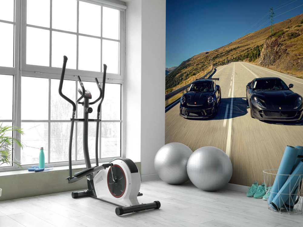 Black supercars in the mountains