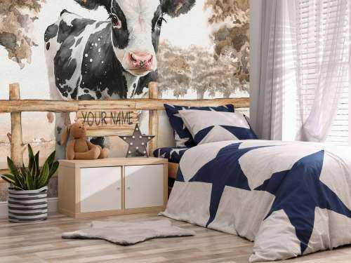 Young cow in a meadow taupe