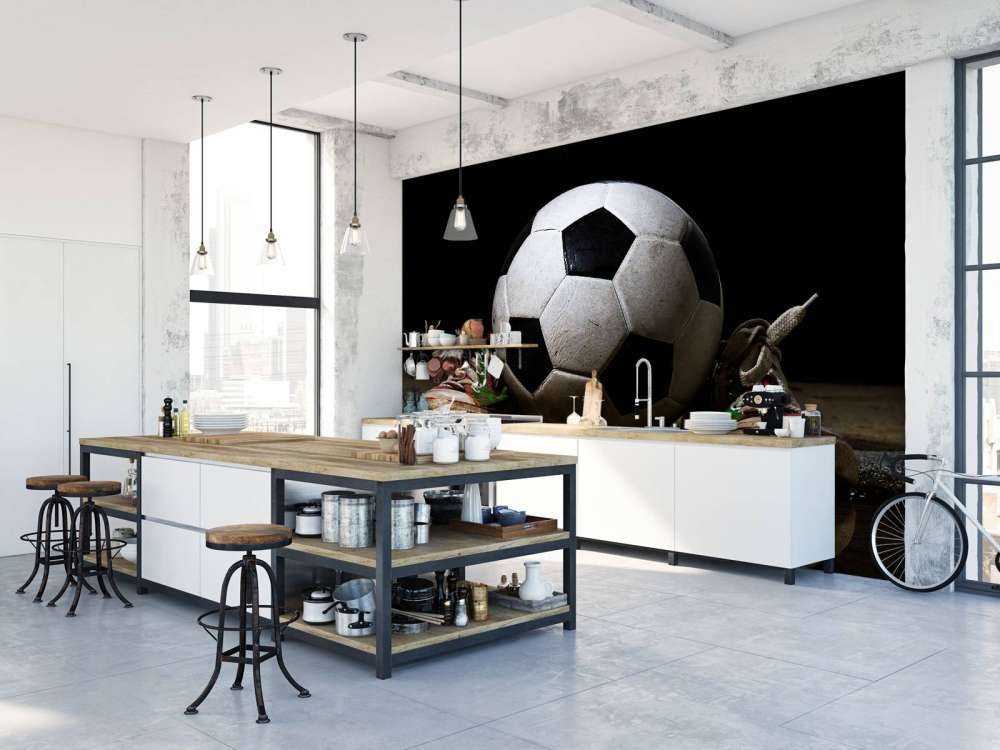 Football between two sneakers