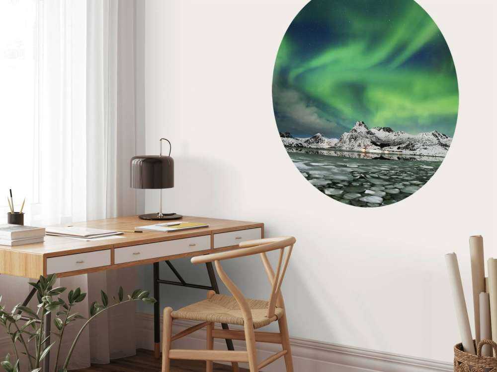 Northern lights above winter landscape