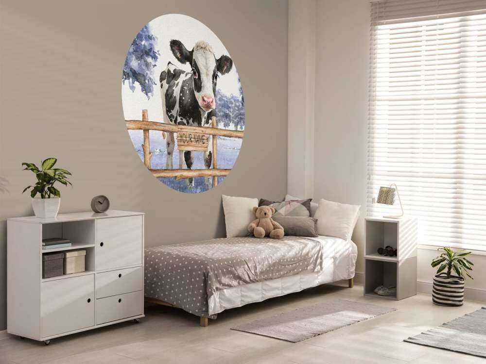 Young cow in a meadow blue