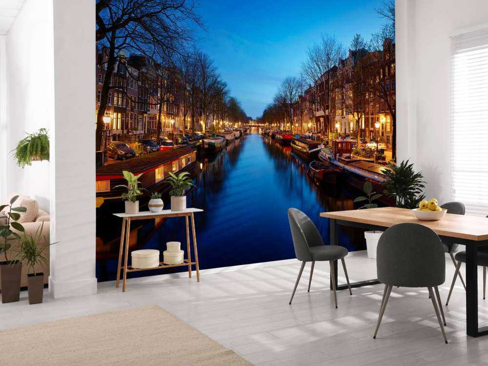 Houseboats along illuminated canal