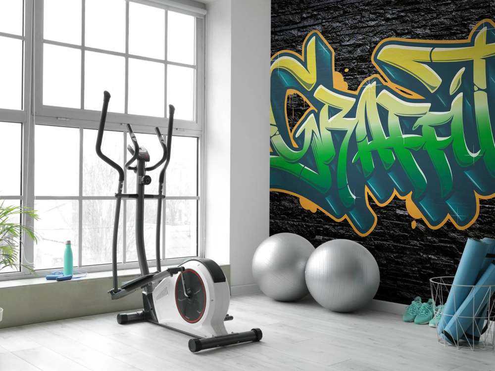 Graffiti on wall of black stones