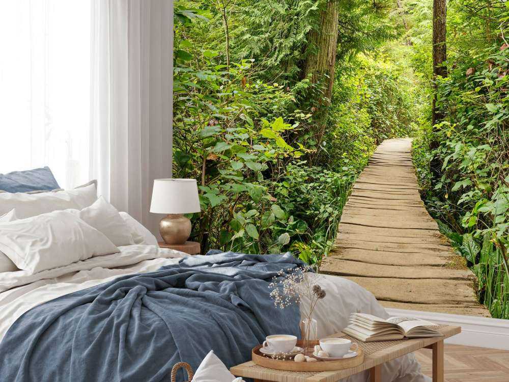 Wooden path through the green