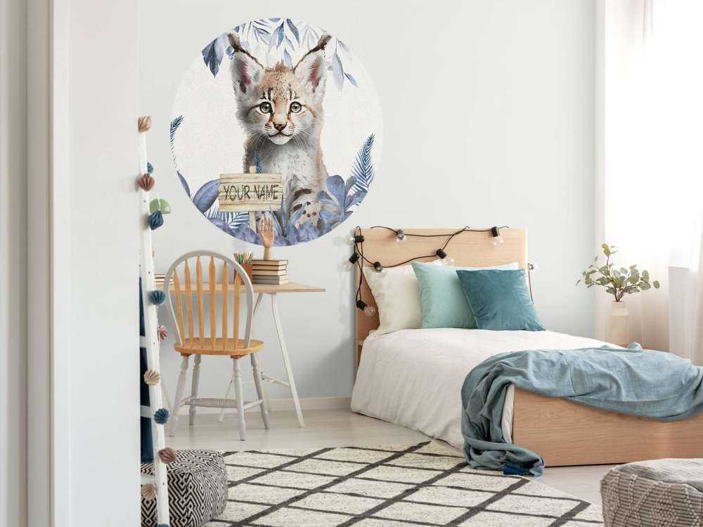 Baby lynx in the jungle blue