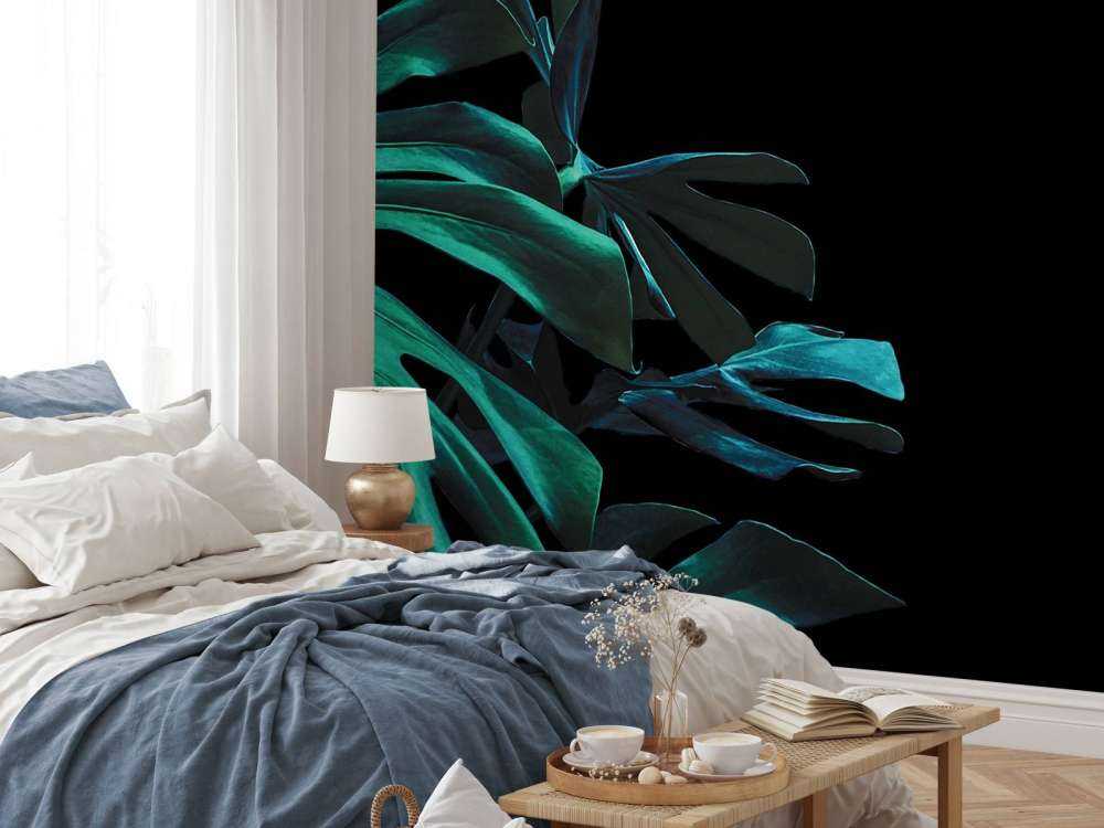 Tropical leaves on black background