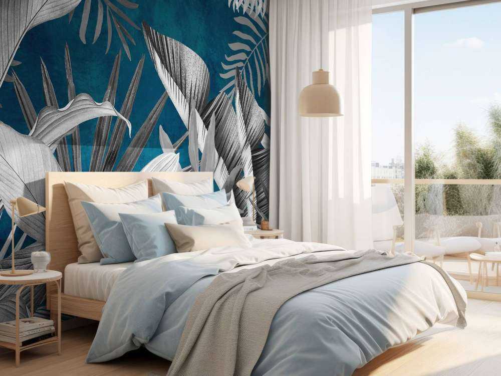 Tropical leaves on a blue background