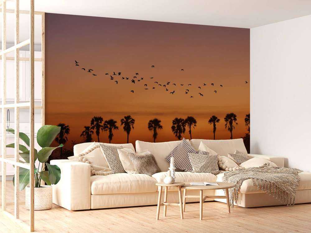 Palm trees with group of birds