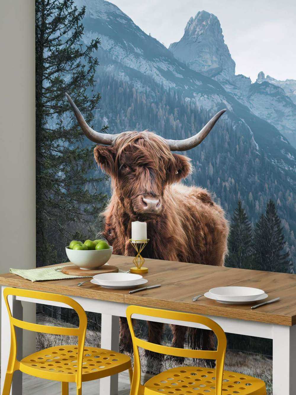 Scottish highlander among the trees