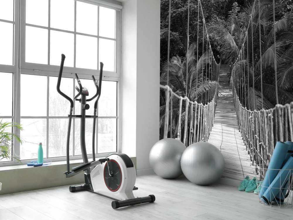 Wooden bridge between the palm trees