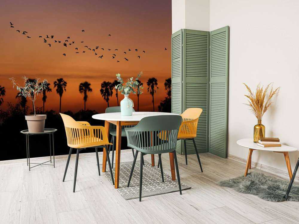 Palm trees with group of birds