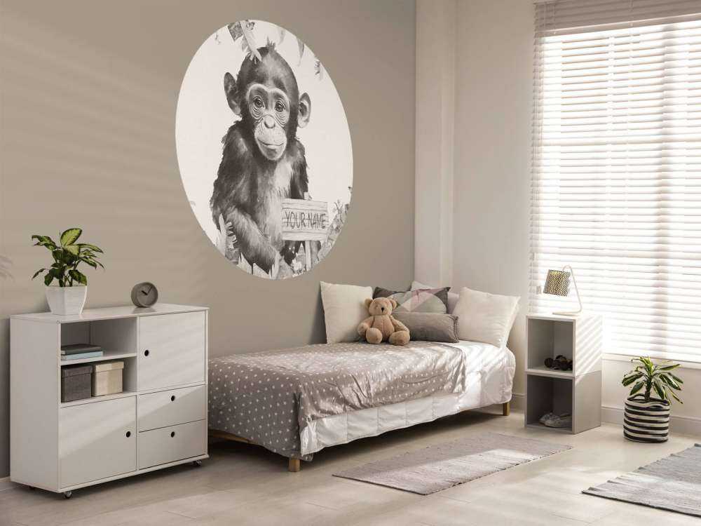 Baby chimpanzee in the jungle beige