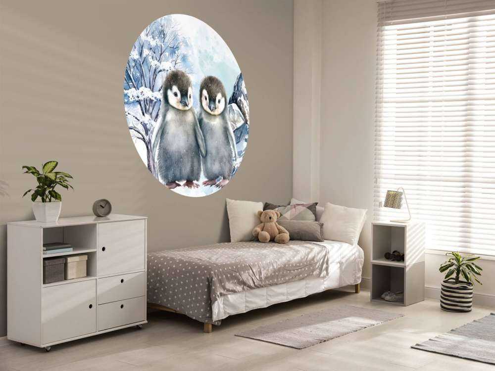 Cute penguins in winter landscape