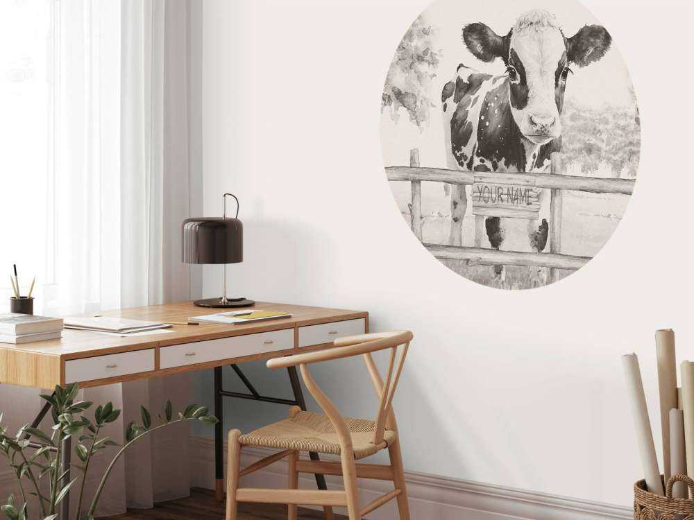 Baby cow in a field beige