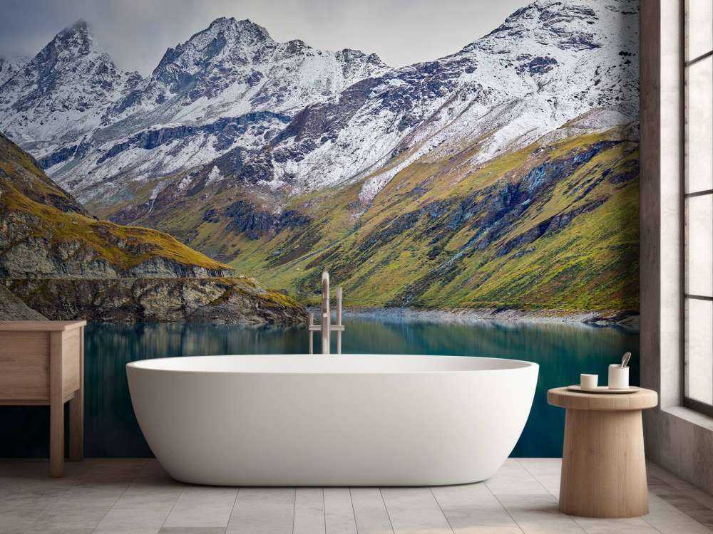 Mountain peaks with snow near mountain lake