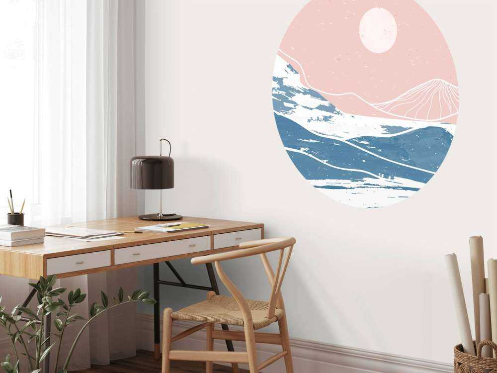 Winter mountains in front of the sun