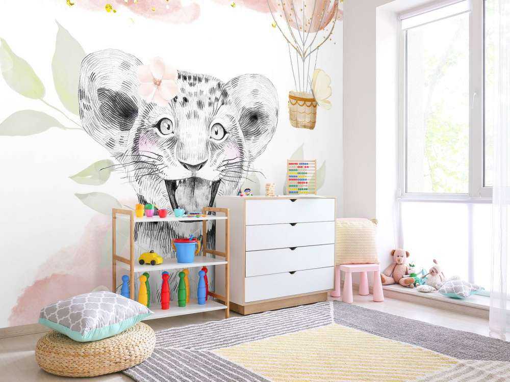 Joyful lion cub and balloon