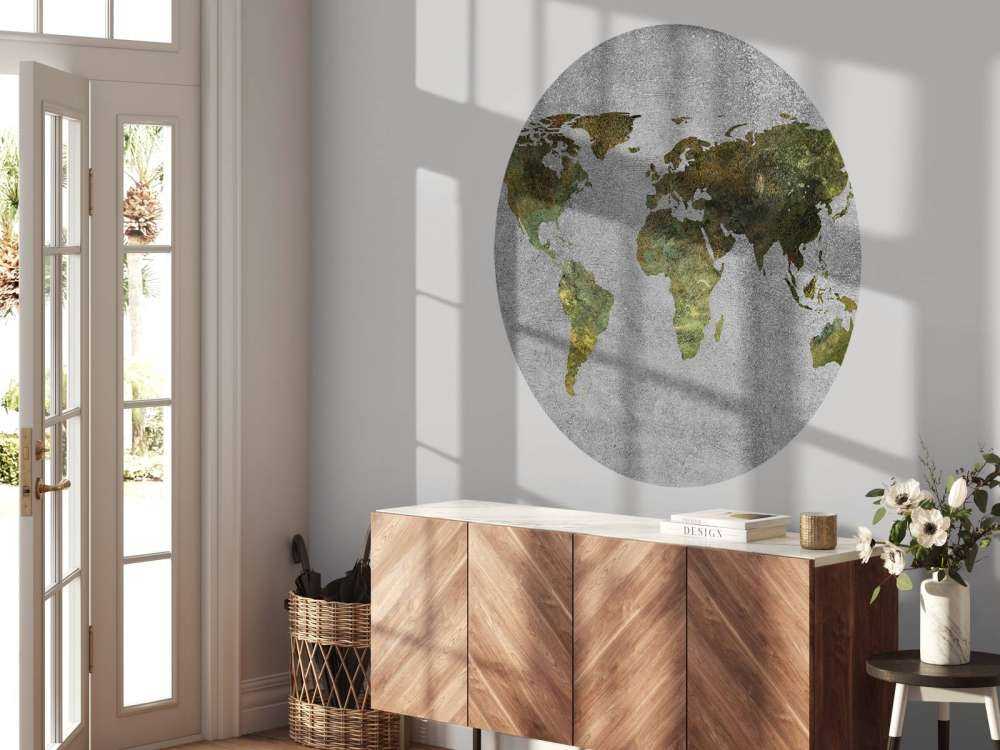 World map with green structure on grey concrete