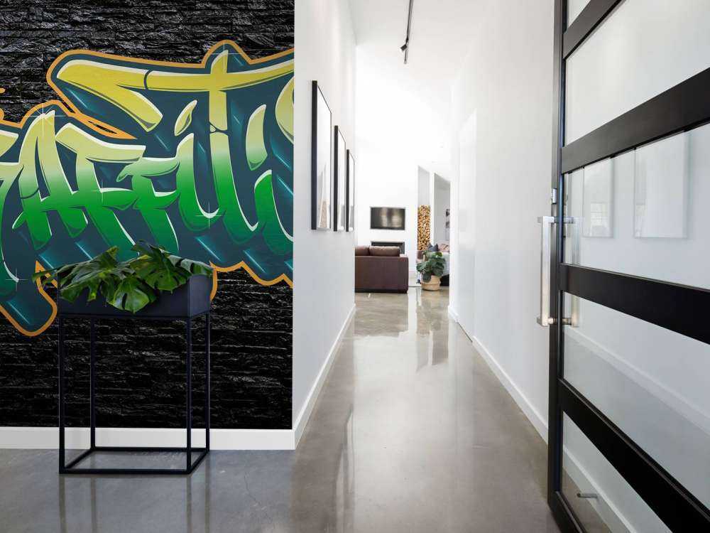 Graffiti on wall of black stones