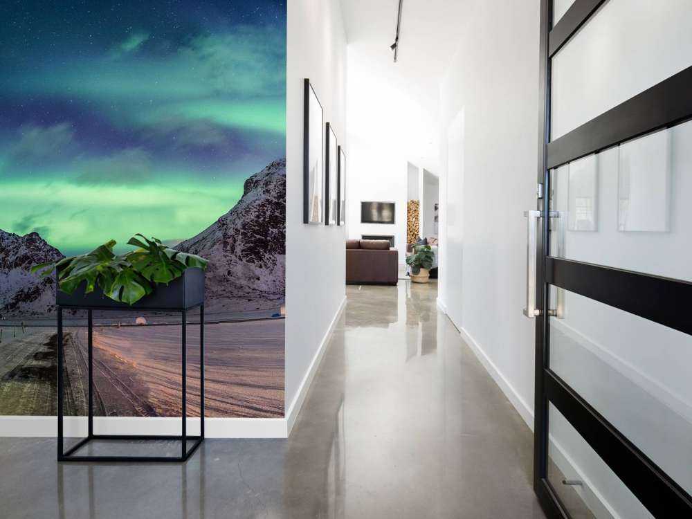 Northern lights above snowy mountains