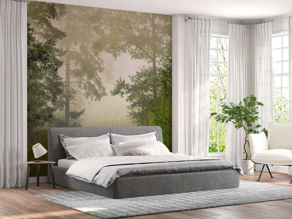 Road through foggy forest