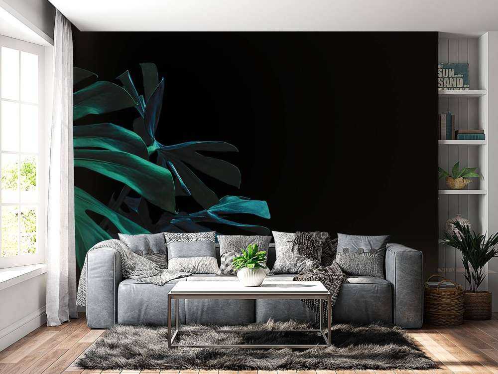 Tropical leaves on black background