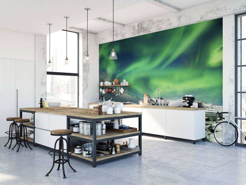 Northern lights above winter landscape