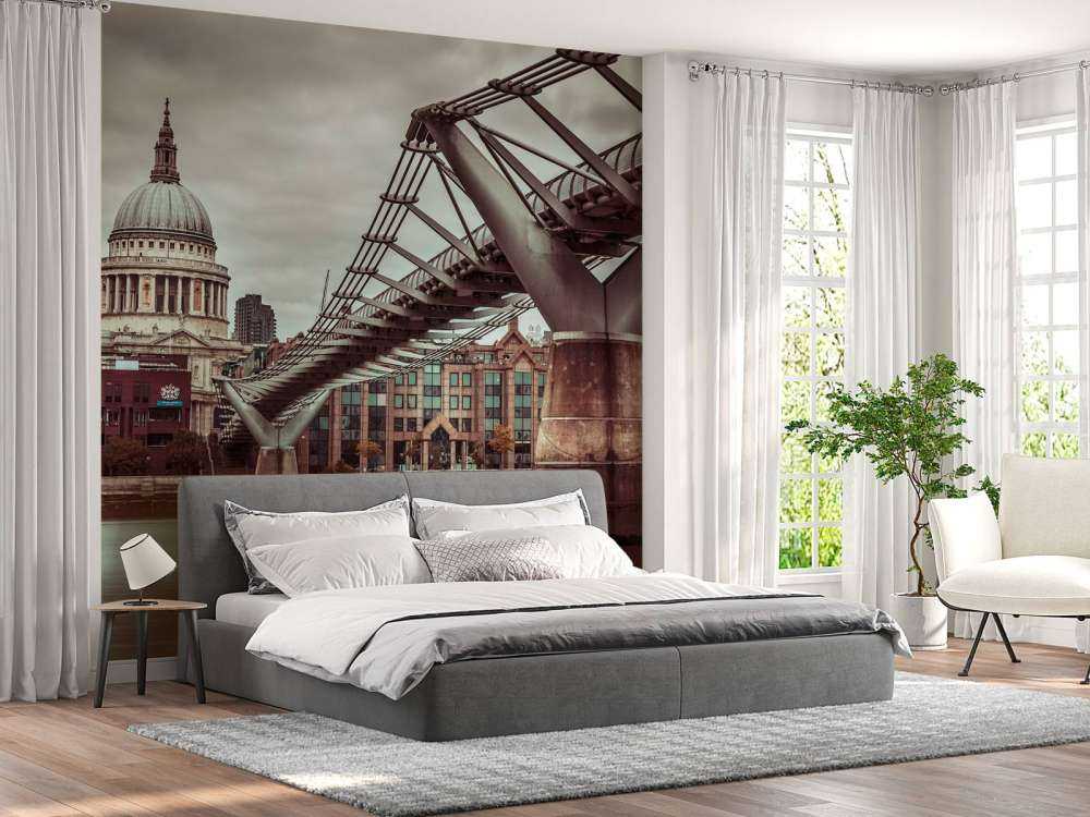 View of St Paul's Cathedral and Millennium Bridge from river thames, London, UK