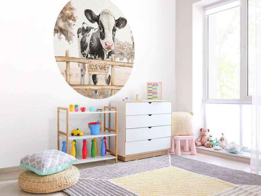 Young cow in a meadow taupe