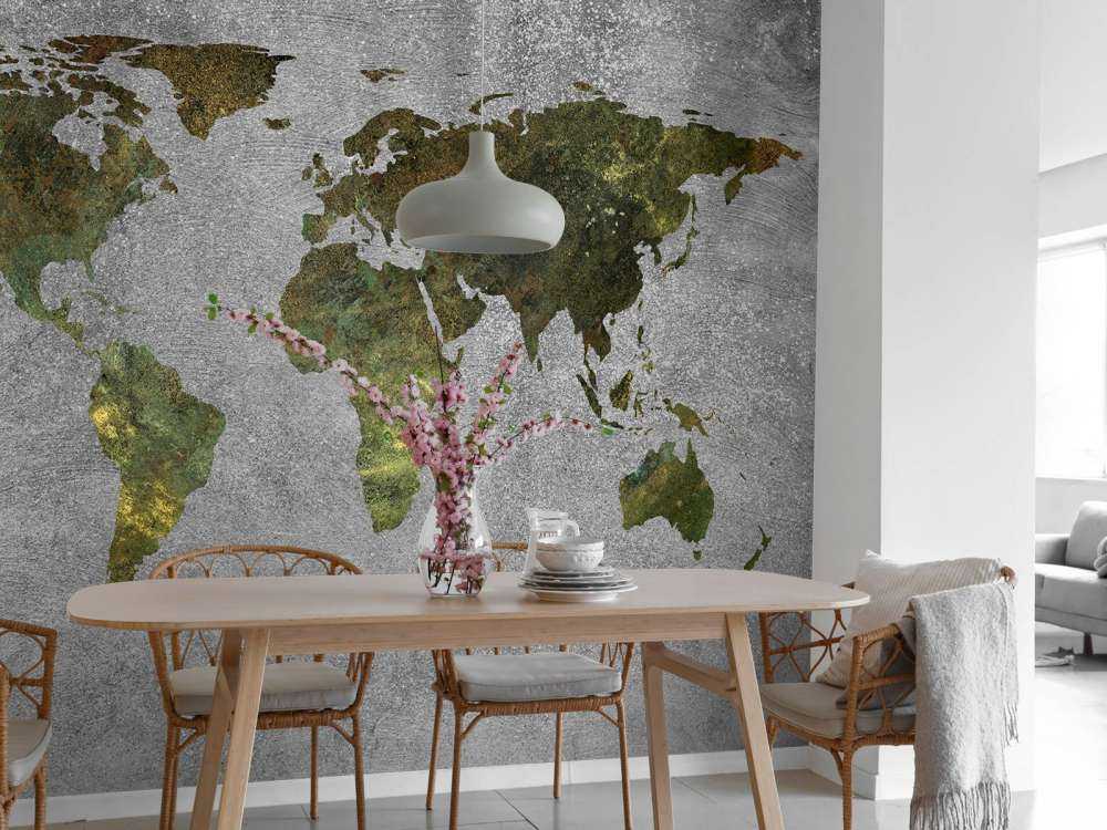 World map with green structure on grey concrete