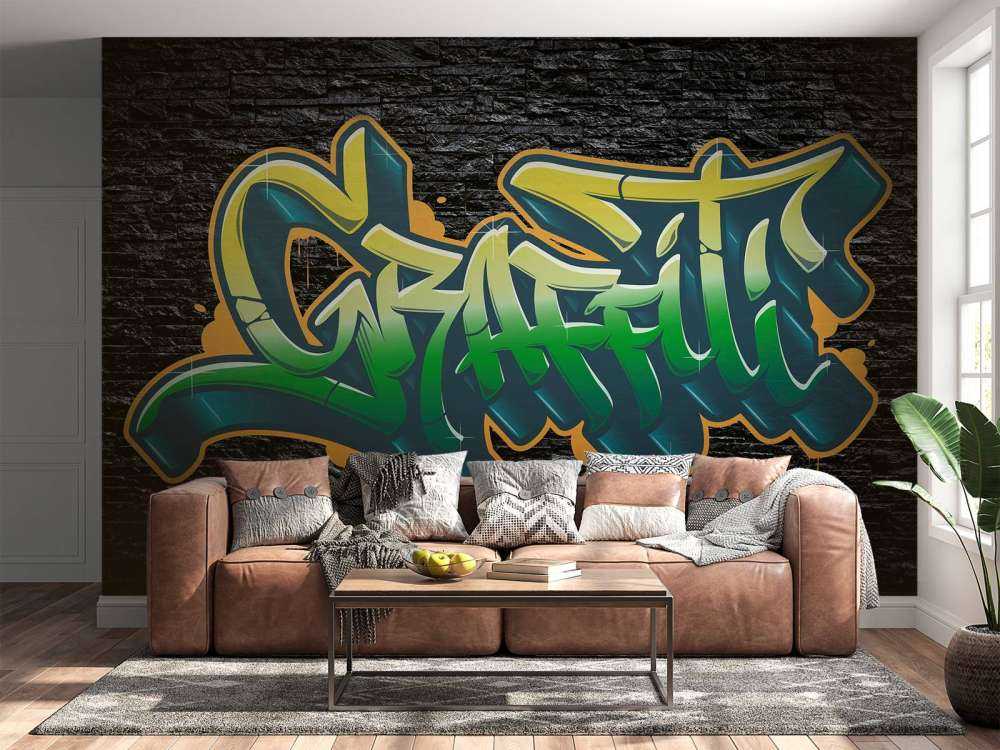 Graffiti on wall of black stones