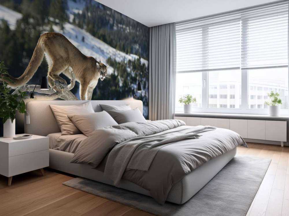 Mountain lion on a dead tree