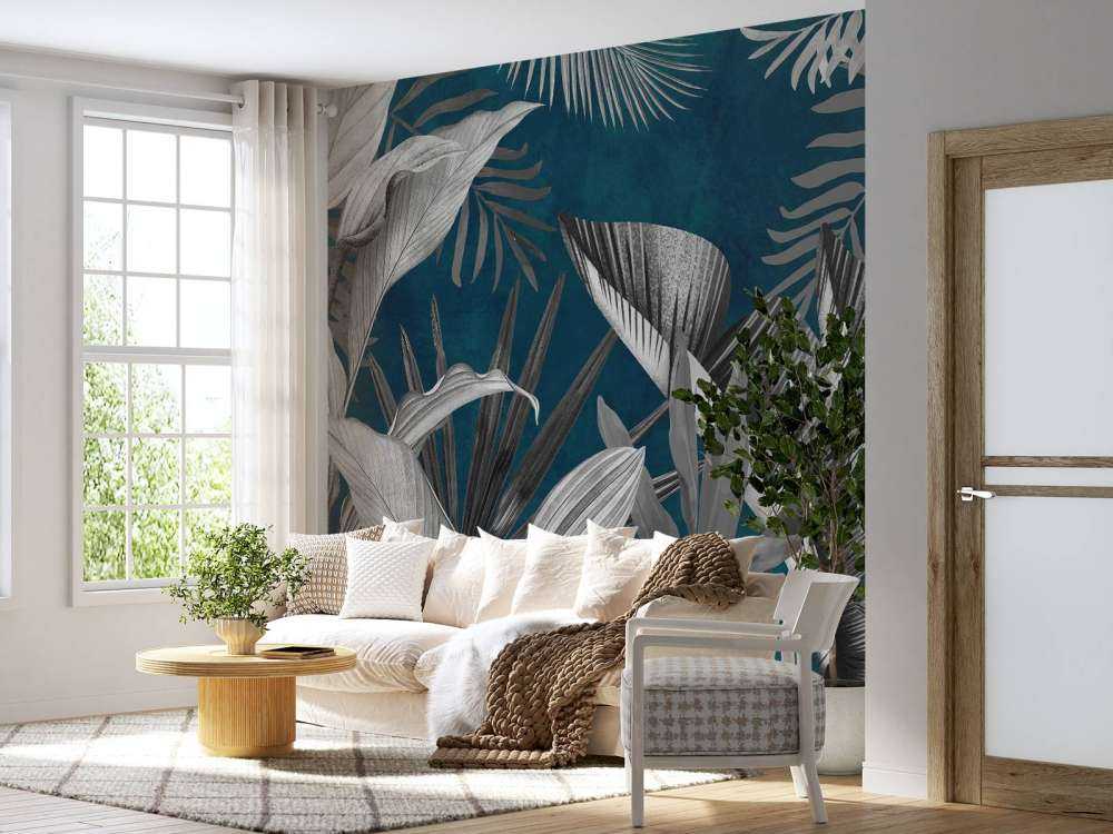 Tropical leaves on a blue background