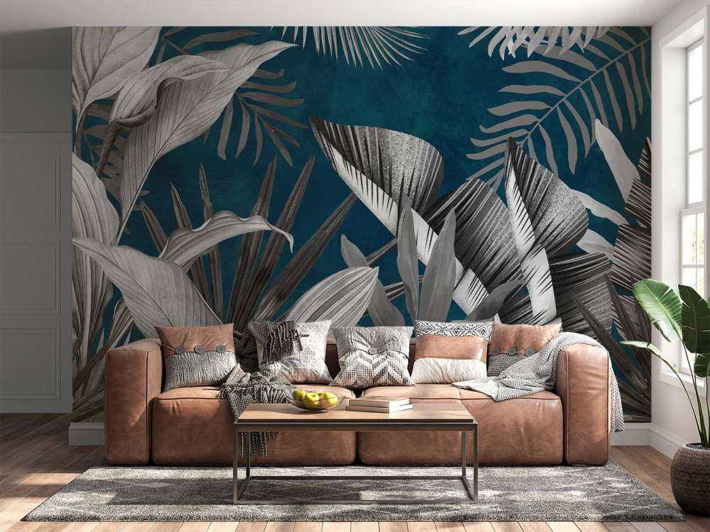 Tropical leaves on a blue background
