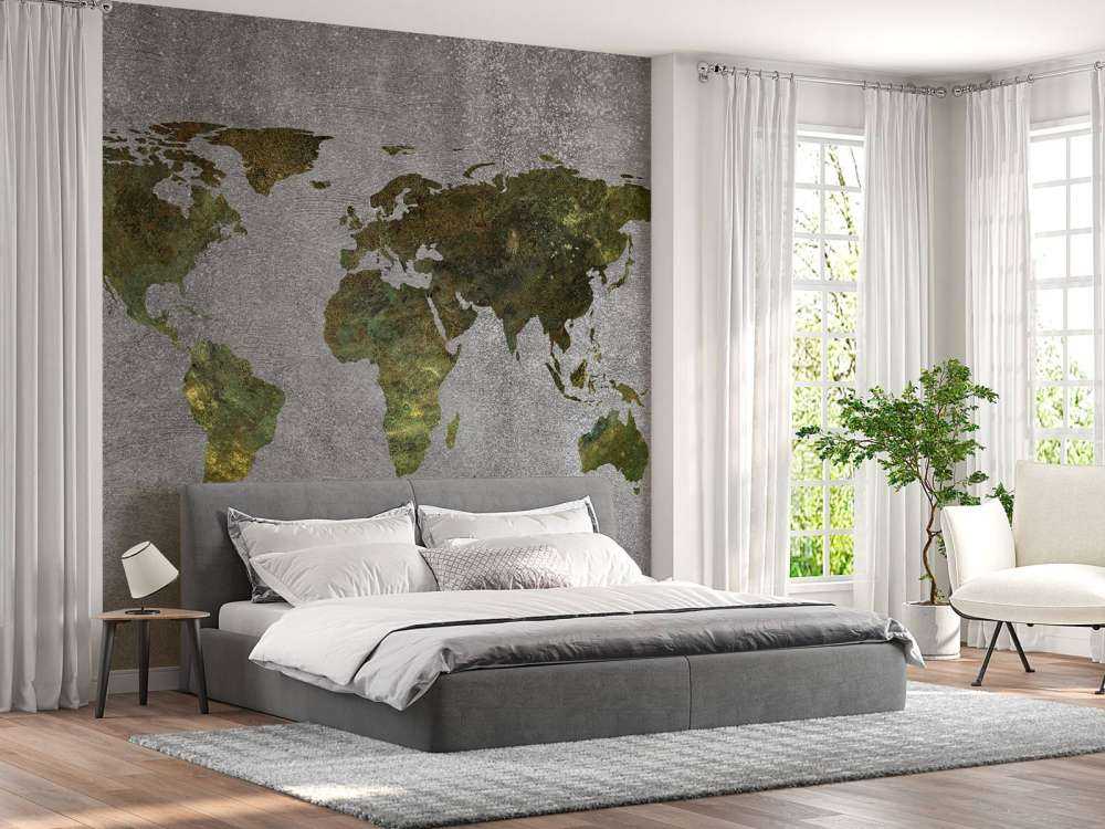 World map with green structure on grey concrete