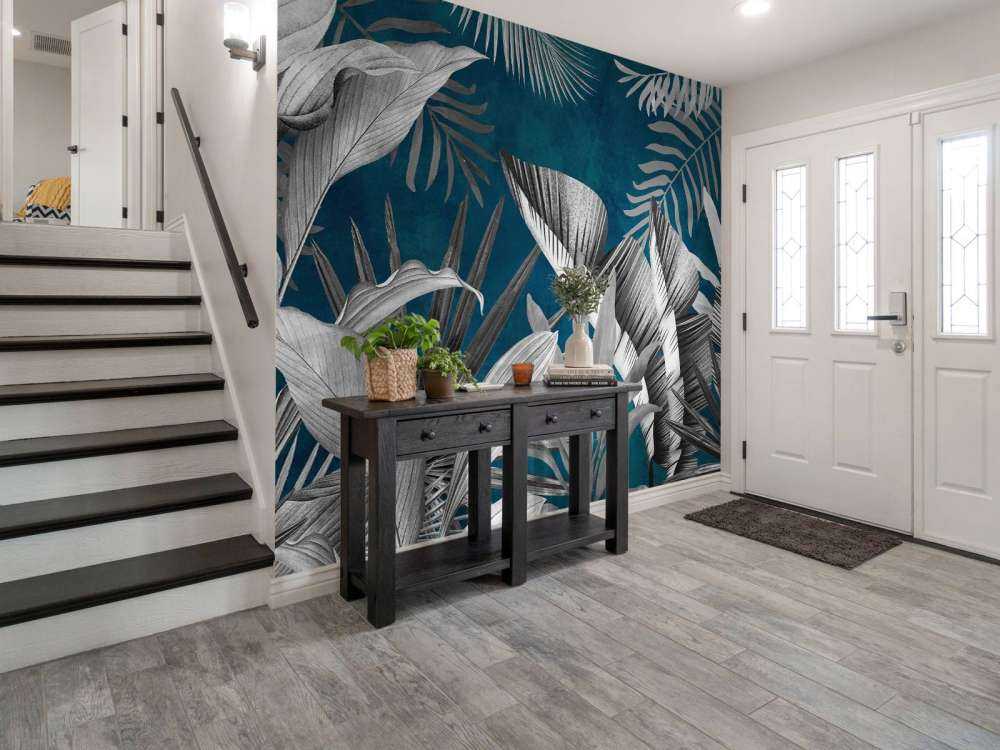 Tropical leaves on a blue background