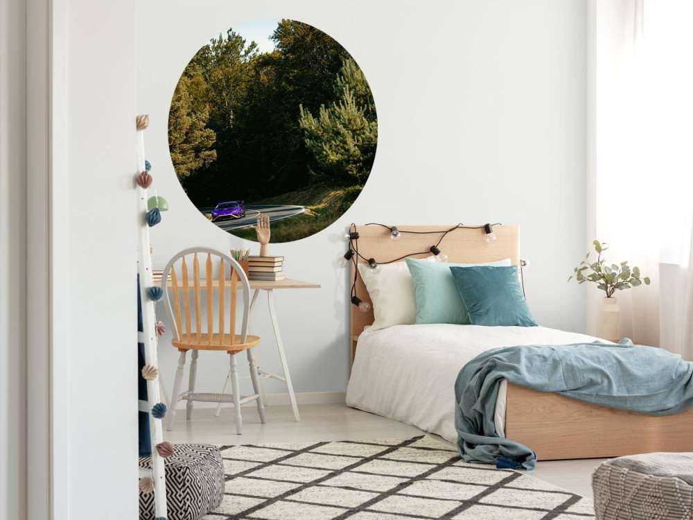 Purple Lamborghini Huracán in woodland landscape