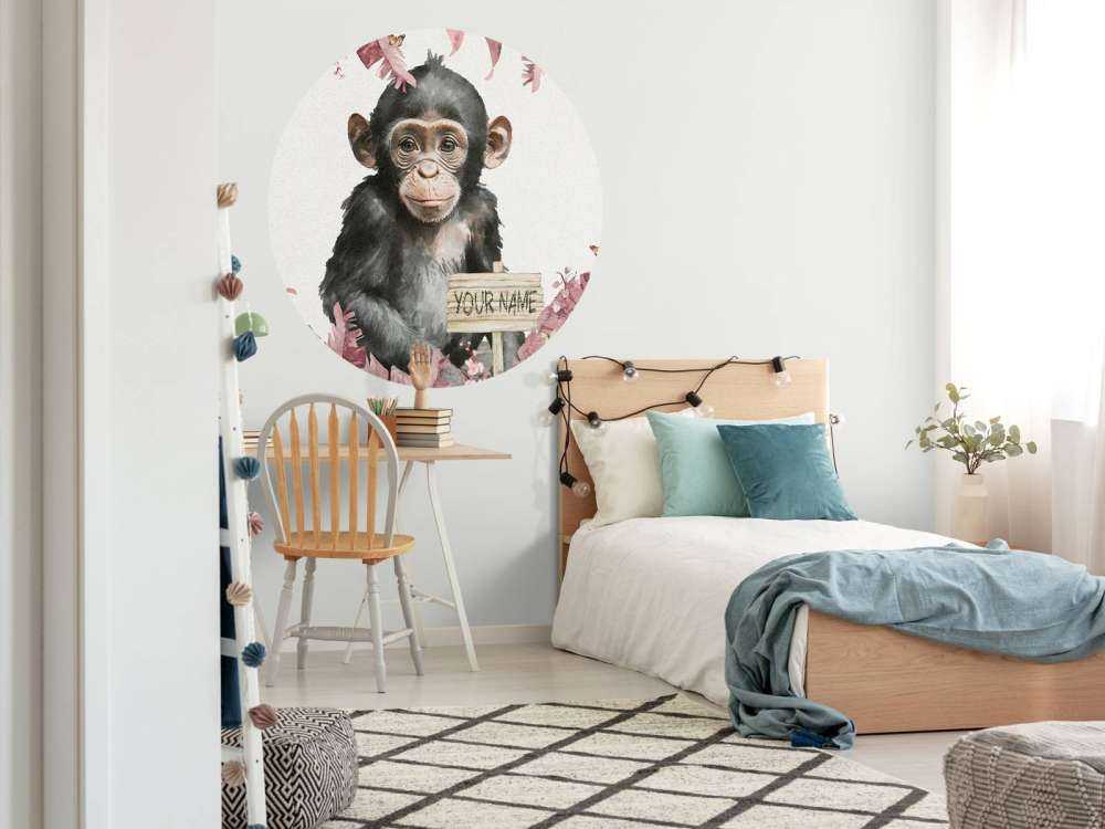 Baby chimpanzee in the jungle pink